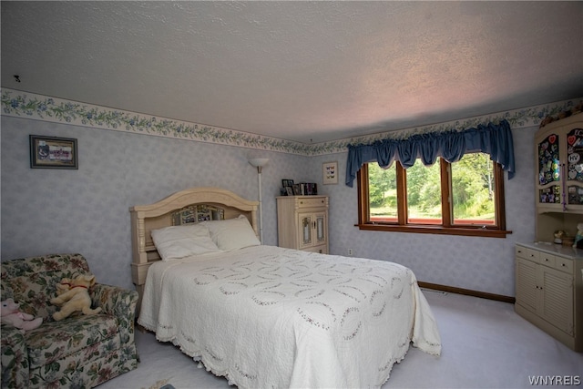 carpeted bedroom with a textured ceiling