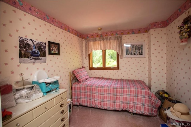 carpeted bedroom with wallpapered walls