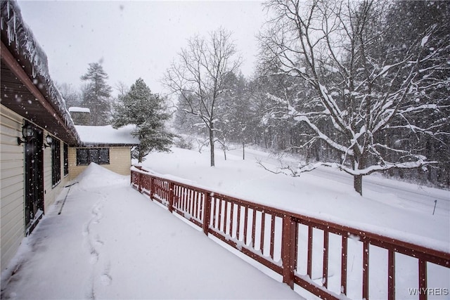 view of snow covered deck