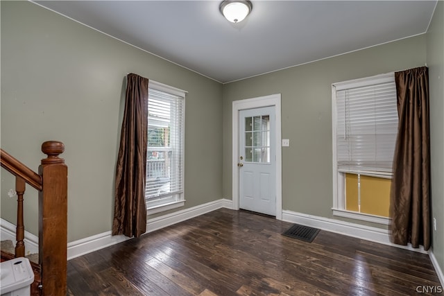 entrance foyer with dark hardwood / wood-style floors