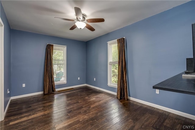 interior space featuring a healthy amount of sunlight, ceiling fan, and hardwood / wood-style floors