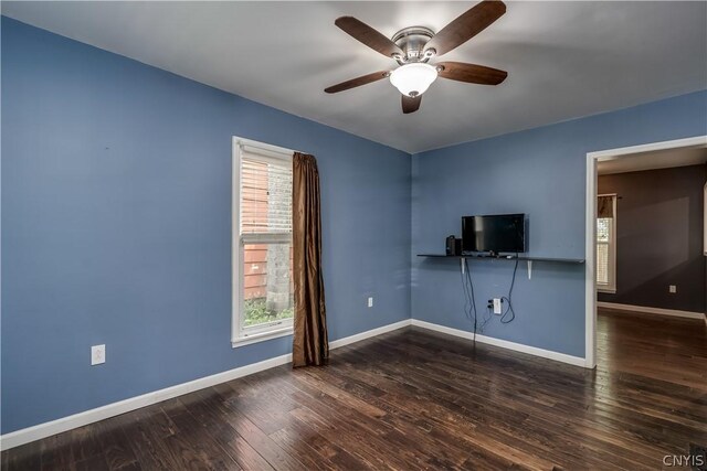 spare room featuring wood-type flooring and ceiling fan