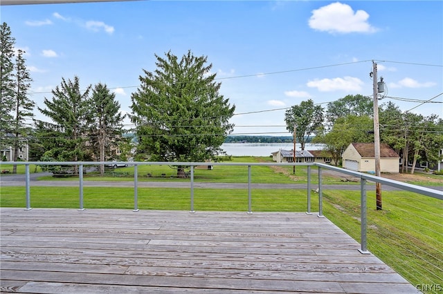 deck featuring a lawn and a water view