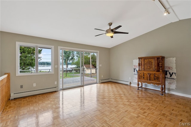 interior space featuring plenty of natural light, a baseboard heating unit, and light parquet floors