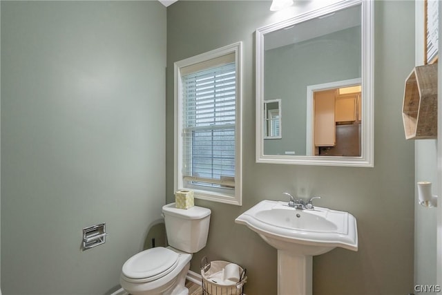 bathroom with sink and toilet