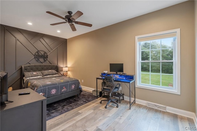 bedroom featuring ceiling fan and light wood-type flooring