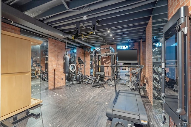 exercise room with brick wall