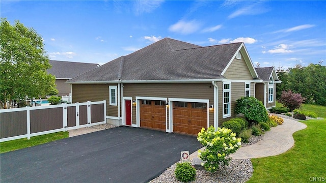 view of property exterior with a yard and a garage