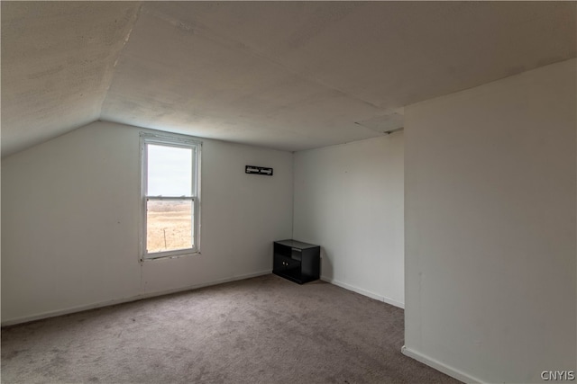 bonus room with carpet and lofted ceiling