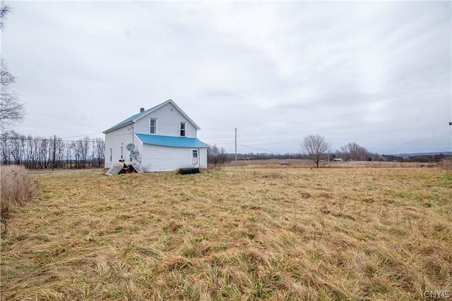 view of yard with a rural view