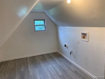 bonus room featuring hardwood / wood-style flooring and vaulted ceiling