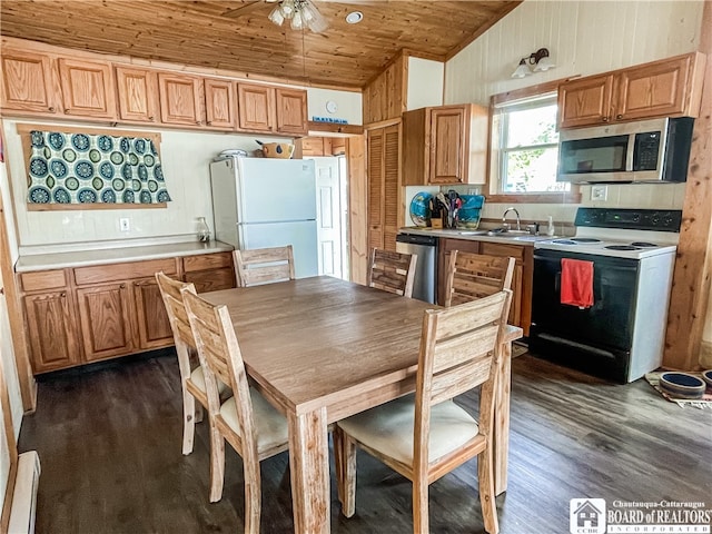 kitchen with wood ceiling, vaulted ceiling, stainless steel appliances, dark hardwood / wood-style flooring, and ceiling fan