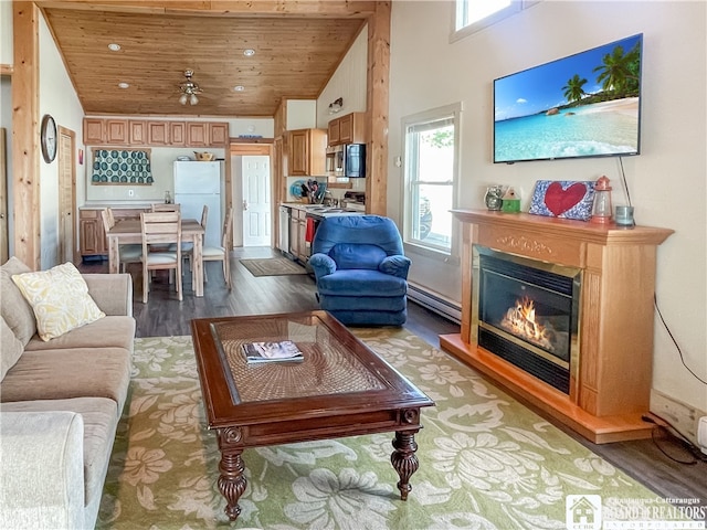 living room with wood ceiling, high vaulted ceiling, baseboard heating, ceiling fan, and hardwood / wood-style floors