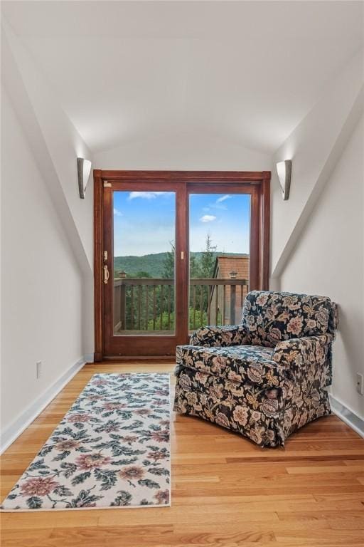 94 Overlook Dr, Andes, NY 13731 - sitting room with lofted ceiling, healthy amount of natural light, wood finished floors, and baseboards