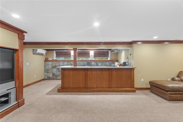 kitchen with light carpet, kitchen peninsula, crown molding, and a wall mounted air conditioner