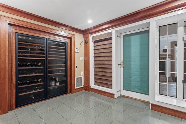 94 Overlook Dr, Andes, NY 13731 - wine cellar featuring beverage cooler, baseboards, and crown molding
