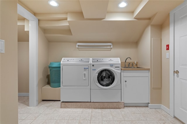 clothes washing area featuring sink and washing machine and dryer