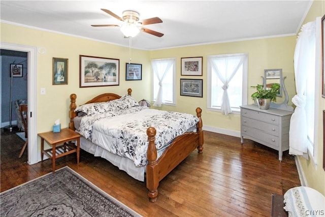 bedroom with ceiling fan, ornamental molding, and dark hardwood / wood-style floors