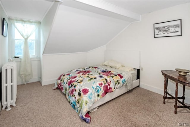 carpeted bedroom with radiator heating unit and vaulted ceiling