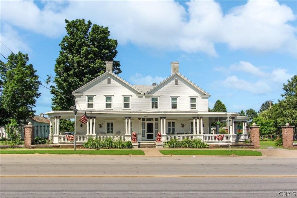 farmhouse-style home with covered porch