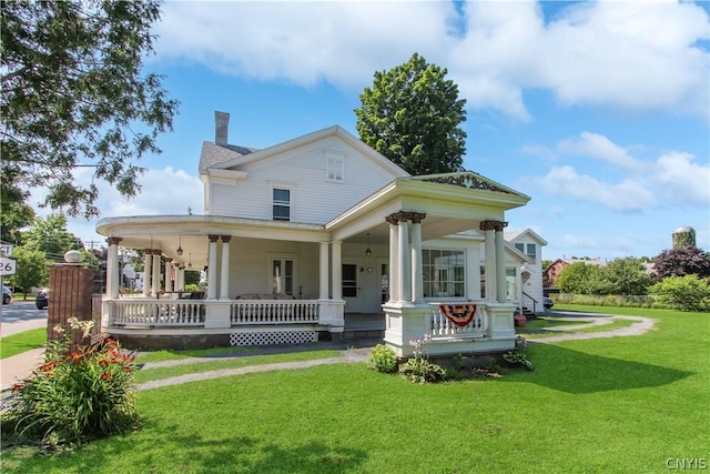 view of front facade with a porch and a front yard