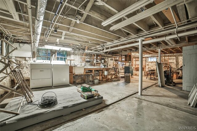 basement with washing machine and clothes dryer