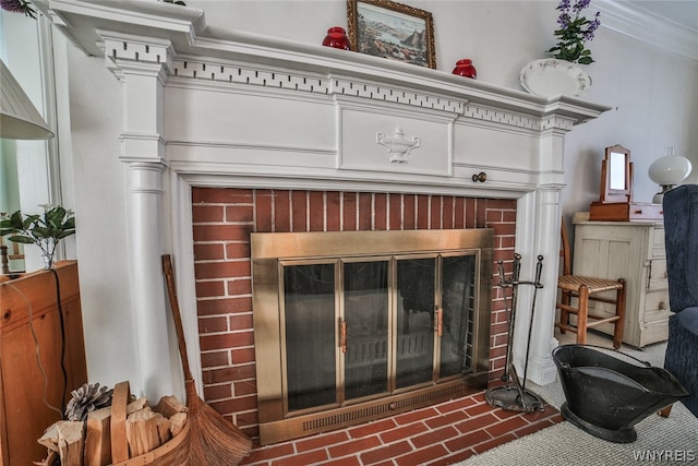 room details featuring a fireplace and crown molding