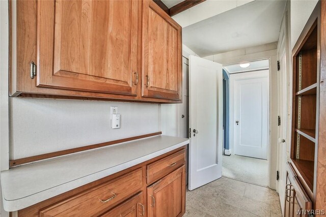 kitchen with light tile patterned flooring