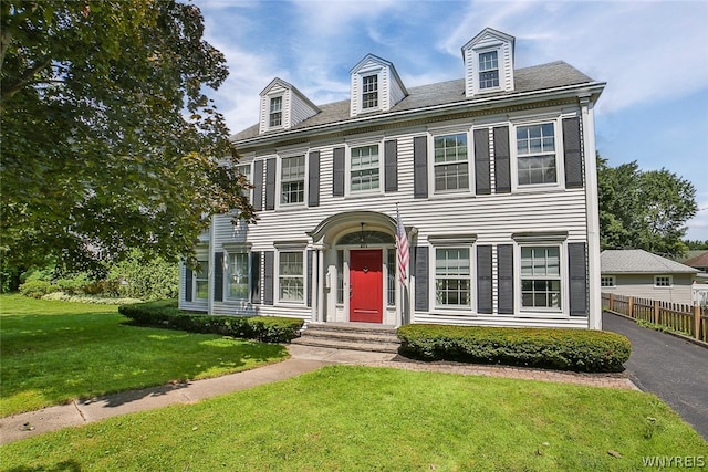 view of front of home with a front lawn