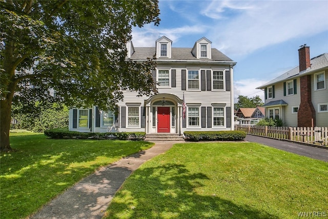 colonial home with a front yard