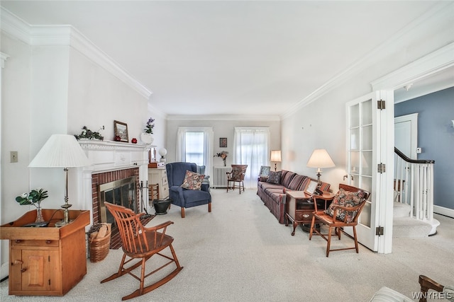 carpeted living room featuring ornamental molding and a brick fireplace