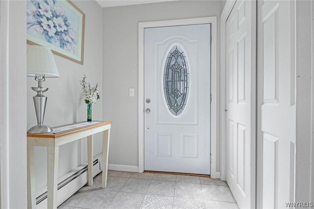 tiled foyer featuring baseboard heating