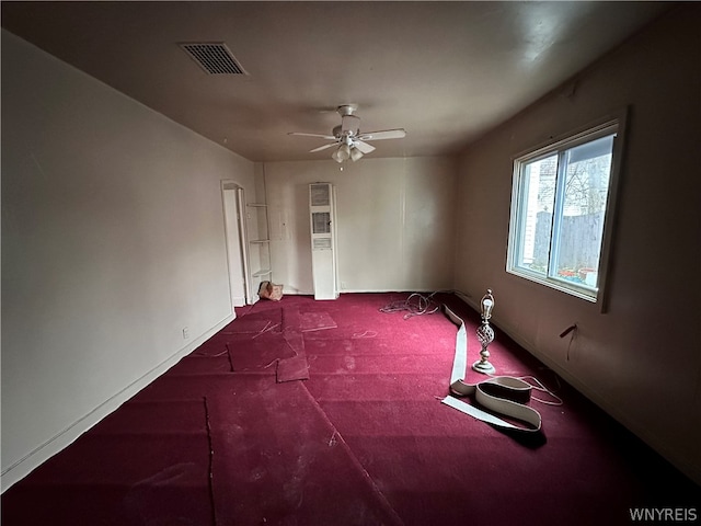 empty room with carpet flooring and ceiling fan