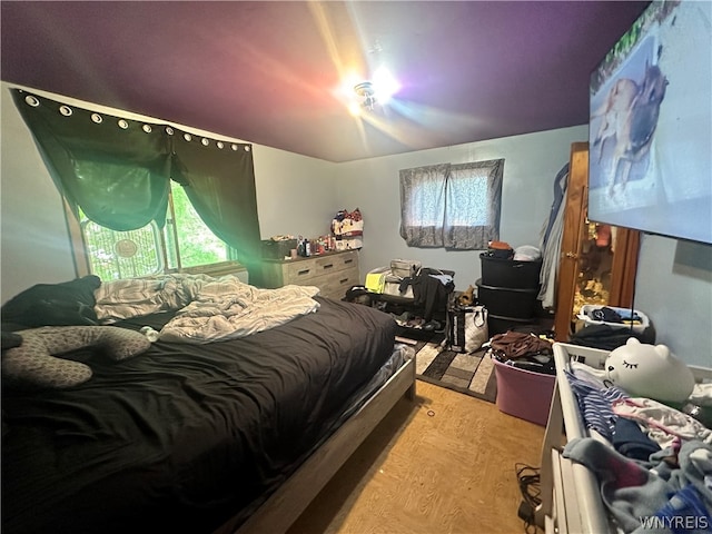 bedroom with wood-type flooring