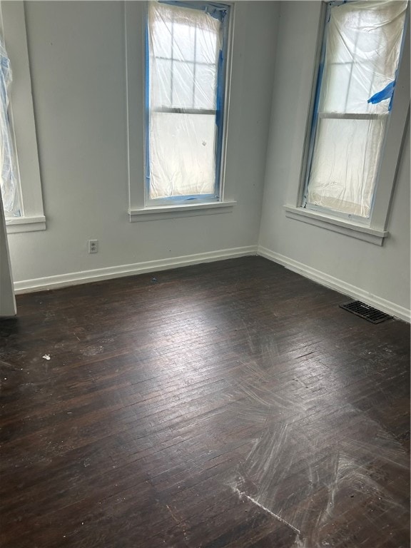 spare room with hardwood / wood-style floors