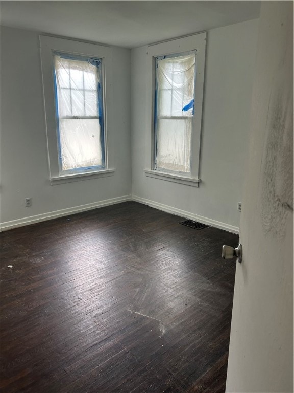 empty room with hardwood / wood-style flooring