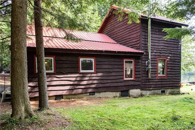 view of home's exterior featuring a yard