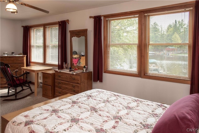 carpeted bedroom featuring ceiling fan