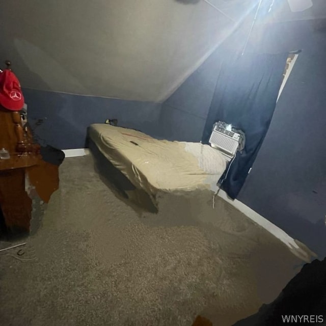 carpeted bedroom featuring vaulted ceiling