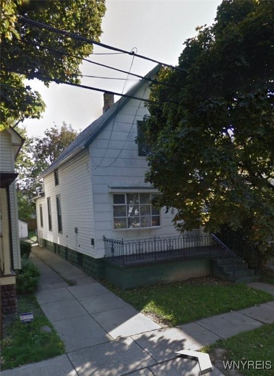 81 Moreland St, Buffalo, NY 14206 - view of side of property with a chimney
