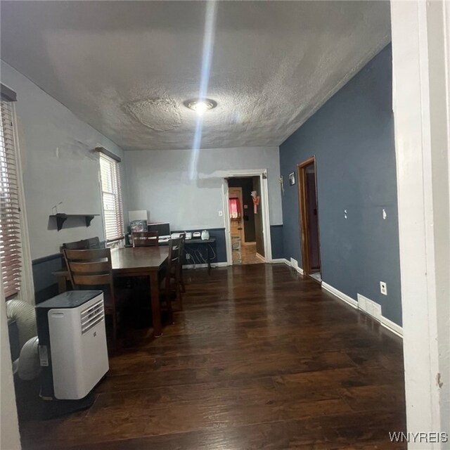 81 Moreland St, Buffalo, NY 14206 - dining space featuring baseboards, visible vents, wood finished floors, and a textured ceiling