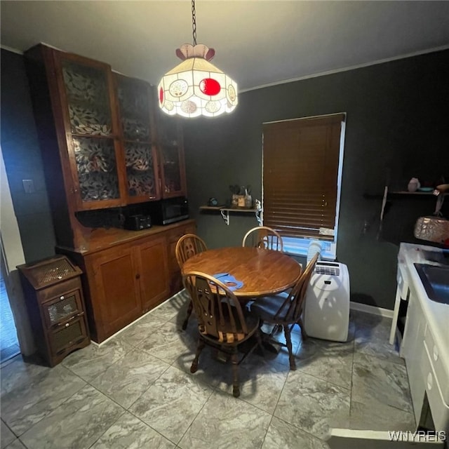 81 Moreland St, Buffalo, NY 14206 - dining space with marble finish floor and ornamental molding