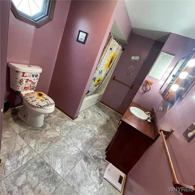 bathroom with vanity, tile patterned flooring, and toilet