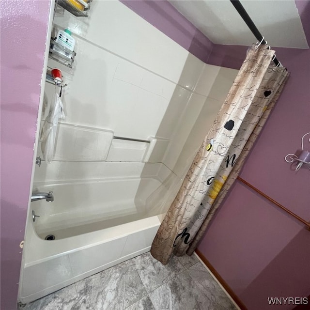 bathroom with shower / tub combo with curtain and tile patterned floors