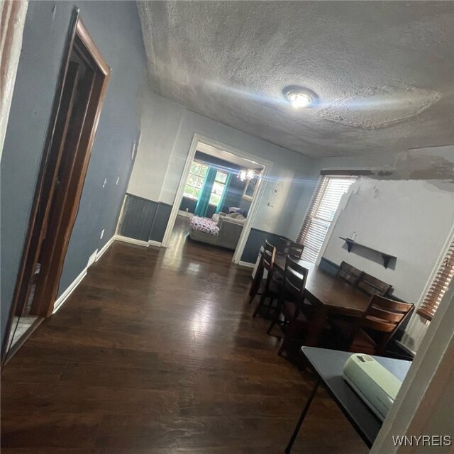 81 Moreland St, Buffalo, NY 14206 - interior space featuring wood finished floors, a textured ceiling, and baseboards