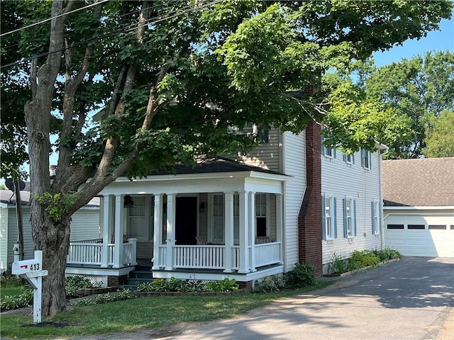 view of front of home with a porch and a garage