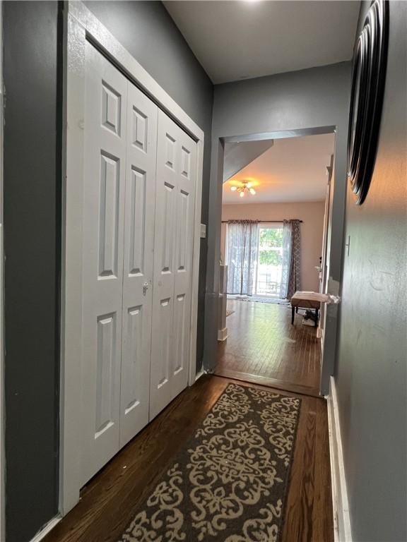 corridor featuring wood finished floors