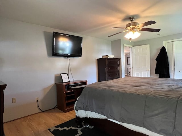 bedroom featuring a ceiling fan and light wood-type flooring