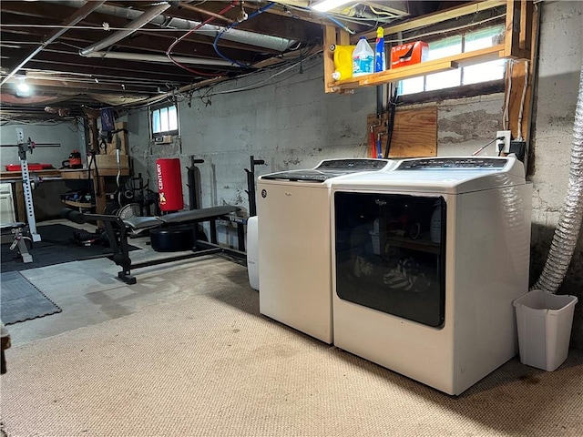 clothes washing area featuring laundry area and washing machine and dryer