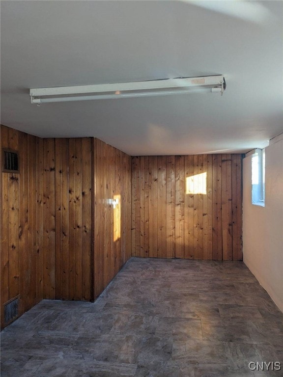 basement with wood walls